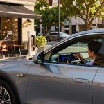 Driver exploring different driving modes in the Cadillac Lyriq to understand whether the driving modes in Cadillac Lyriq offer different ranges or battery usages?
