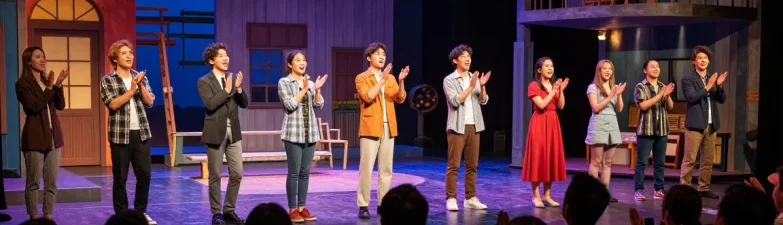 ROKOK 88 theatre scene with captivated audience enjoying a vibrant performance.